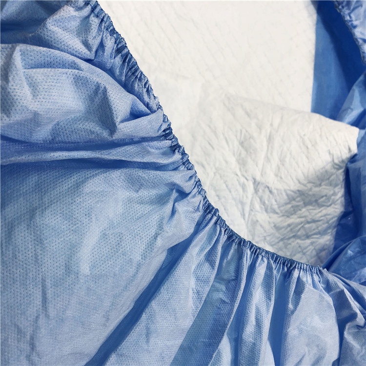 Disposable absorbent bedspread with full elastic 